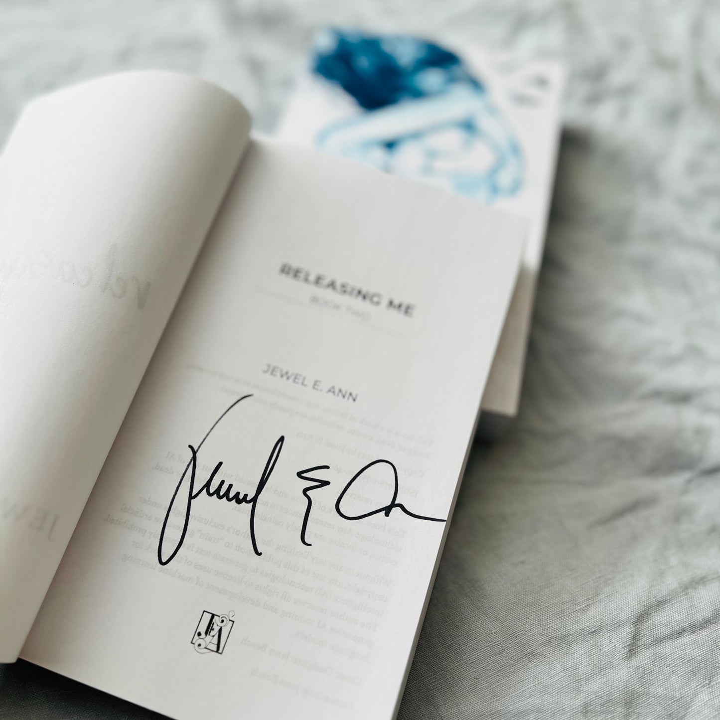 Photo of the title page to the book Releasing Me by Jewel E. Ann with Jewel's signature it