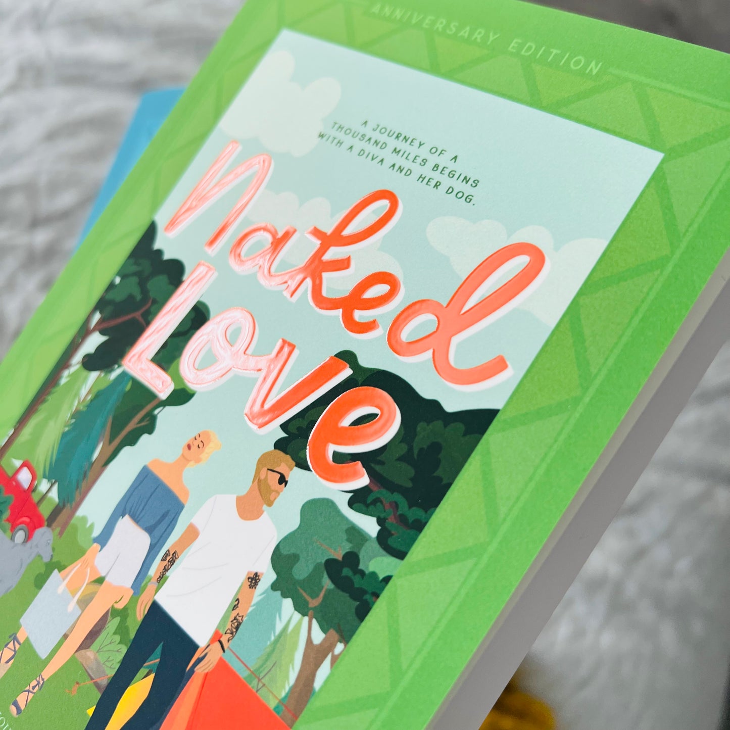 close up look at the diamond clear coat on the title of the illustrated Naked Love cover by Jewel E Ann, a contemporary romance and rom-com