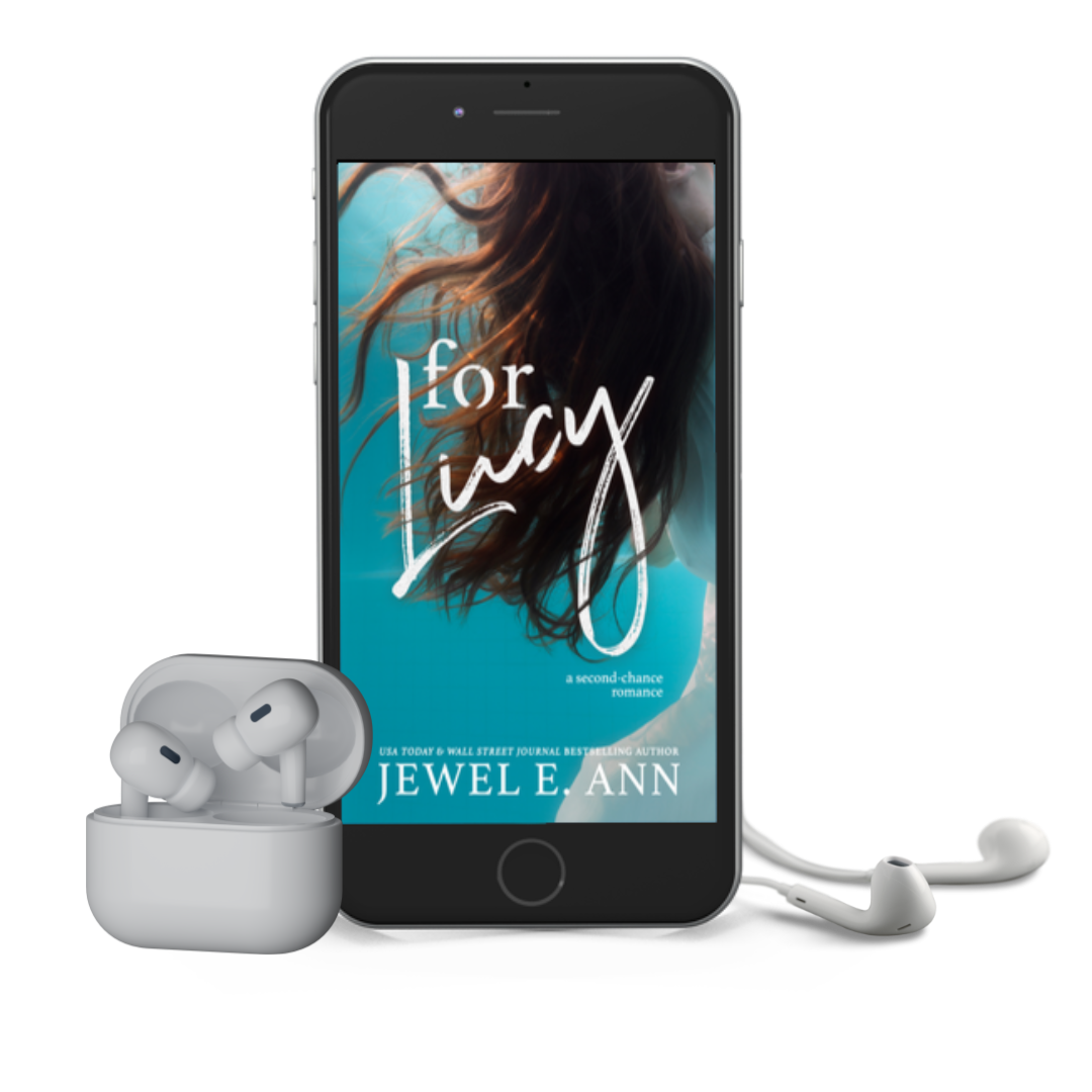 Mockup of a phone and earbuds with the For Lucy cover by Jewel E Ann, a contemporary romance and women's fiction novel.