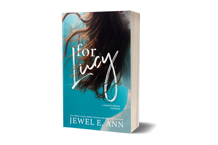 Paperback book mockup up of a cover of  For Lucy by Jewel E. Ann a contemporary romance and women's fiction novel.