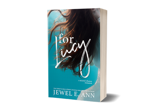 Paperback book mockup up of a cover of  For Lucy by Jewel E. Ann a contemporary romance and women's fiction novel.