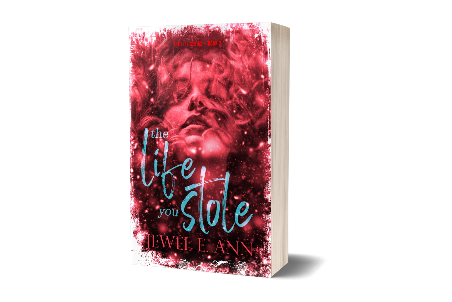 Paperback book mockup up of a cover of The Life You Stole by Jewel E. Ann a romantic suspense.
