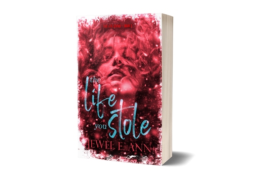 Paperback book mockup up of a cover of The Life You Stole by Jewel E. Ann a romantic suspense.
